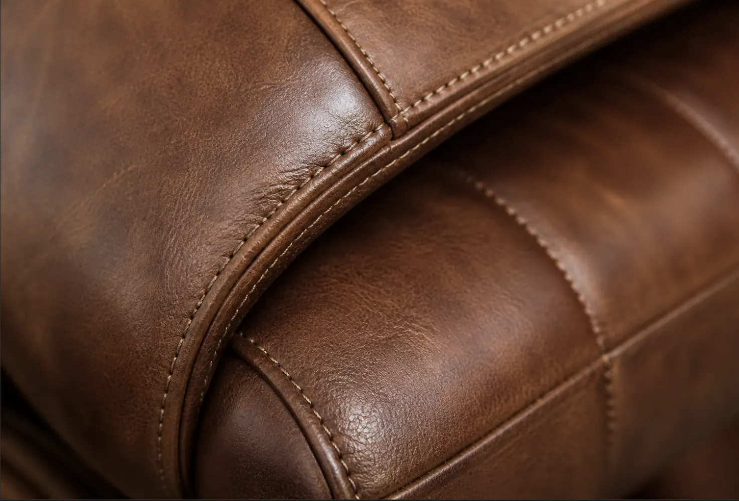 Saddle-brown leather with hand-stitched panels